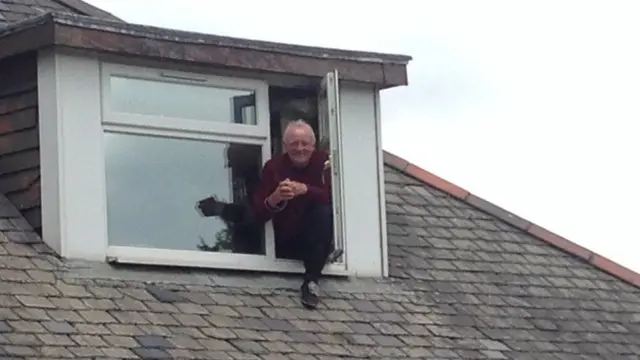 Man looking out of a window