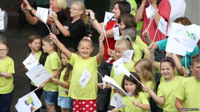 Children wave flags