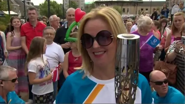 Clare Grogan carries the Queen's baton in Johnstone