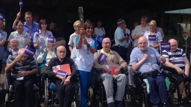 Shereen Nanjiani poses with veterans at Erskine hospital