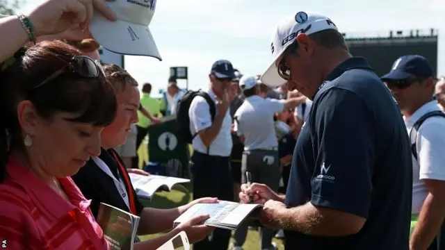 Lee Westwood signs autographs