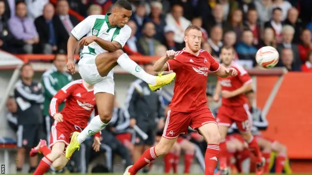 Aberdeen's Adam Rooney (right) closes down Johan Kappelhof