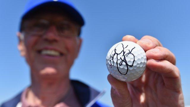 Course marshal Bill Davies with a signed ball from Rickie Fowler