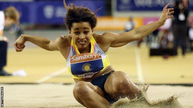 Jazmin Sawyers as she lands in the long jump pit