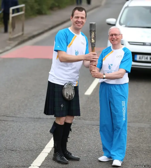 Darren Jarvie hands the baton to Peter Doig