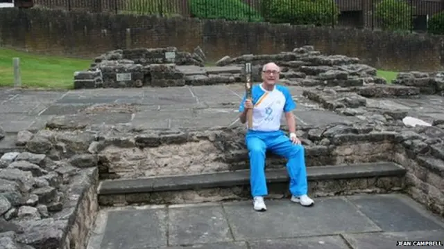 Baton bearer sitting on Roman ruins