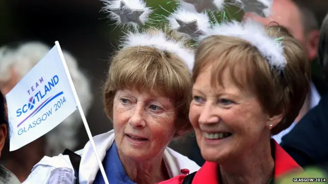 Supporters line the route of the Queen's Baton.