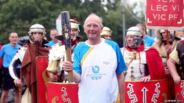 Baton bearer flanked by Roman soldiers