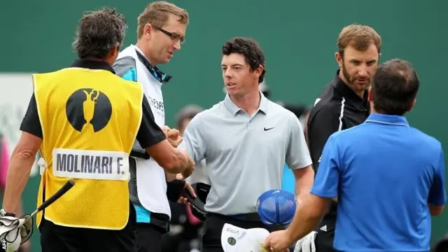 Rory McIlroy shakes hands on the 18th green