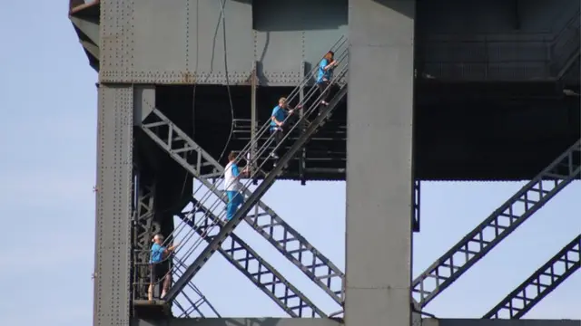 Baton bearers on crane