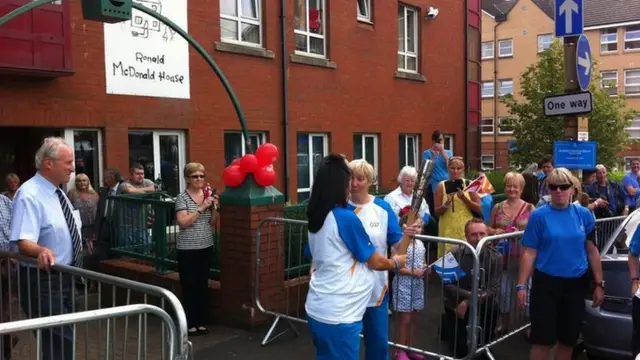 Louise Patterson hand the baton to Dina King