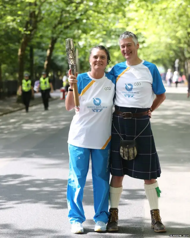 Anita Mellor hands the baton to Eric Kay