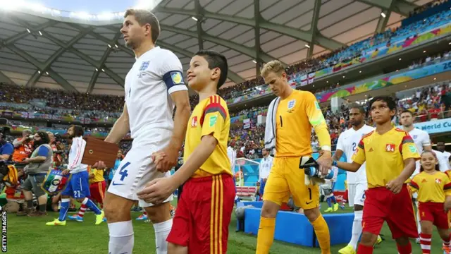 Steven Gerrard leads England out