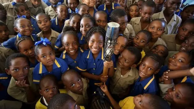 Children hold the Queen's Baton