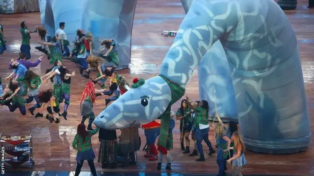 Dancers perform with a Loch Ness Monster