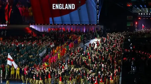 Flag bearer and squash player Nick Matthew leads the England athletes
