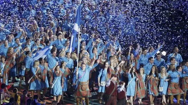 The flag of Scotland is carried by Euan Burton
