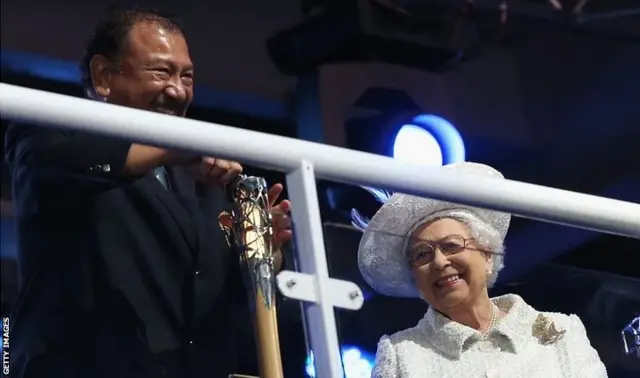 Prince Imran the CGF President attempts to retrieve the message from the baton