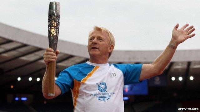 Gordon Strachan carries the Glasgow 2014 Commonwealth Games Queen's Baton at Hampden Park