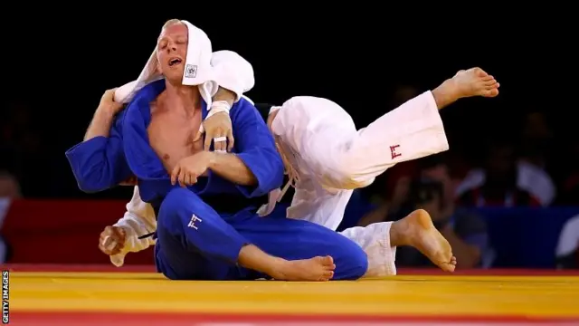 Judo - Colin Oates of England (white) beats James Millar of Scotland