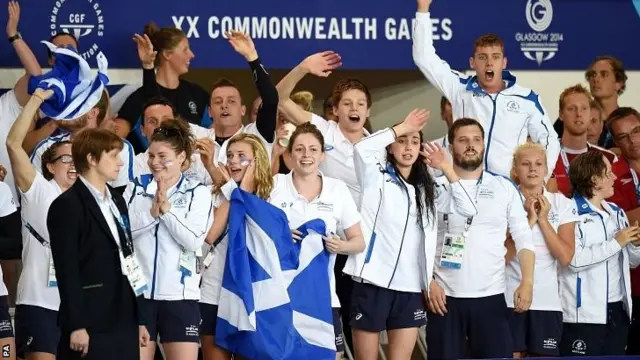 The Scotland team celebrate after Hannah Miley wins