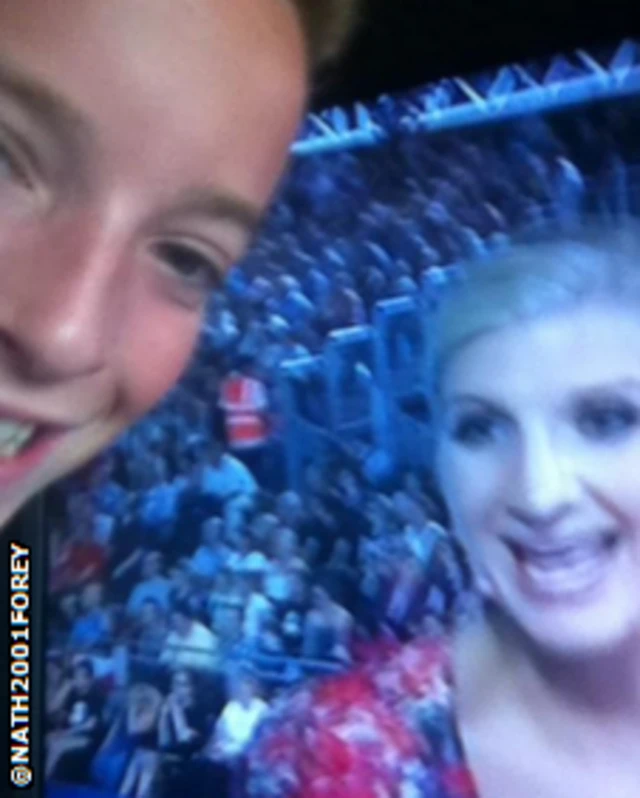 Child with Rebecca Adlington on television