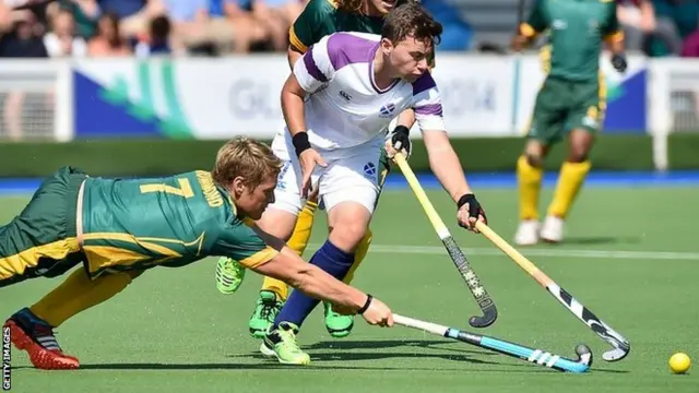 South Africa's Timothy Drummond (L) challenges Scotland's Alan Forsyth