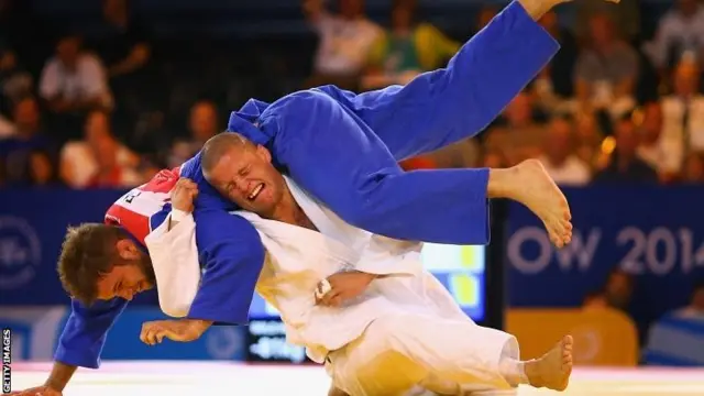 Owen Livesey of England (white) competes with Tom Reed of England