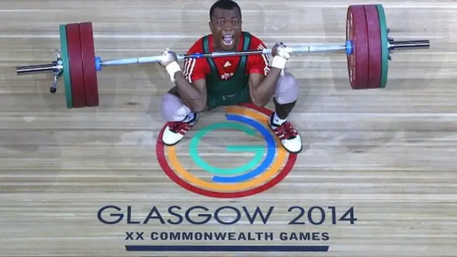 Charles Ssekyaaya of Uganda competes in the Men's 62kg Group B Weightlifting