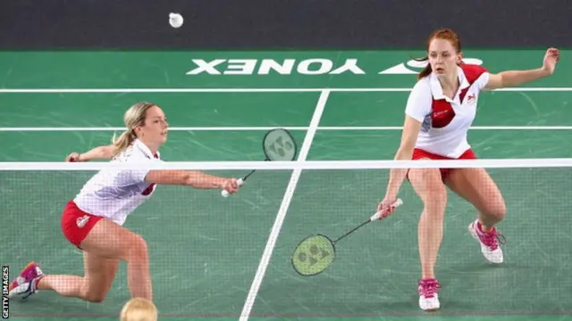 Gabby Adcock and Lauren Smith of England play a shot during their Mixed Team Group Play match against Jersey