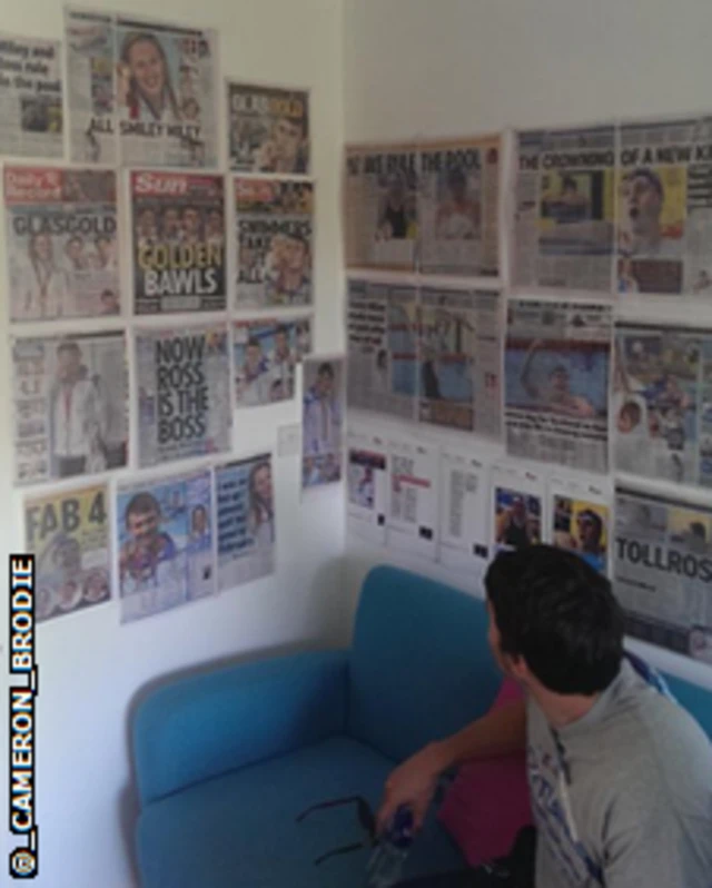 Newspapers on wall