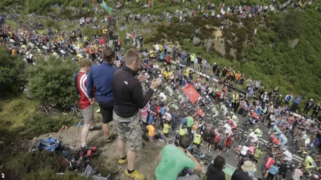 Crowds pack Blubberhouses pass during the second stage of the Tour de France