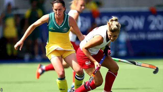 Australia's Madonna Bylth, left, vies for the ball with England's Georgie Twigg