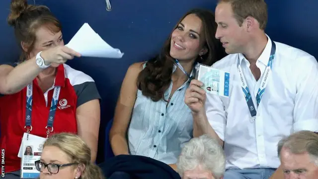 Duke and Duchess of Cambridge use security pass as a fan