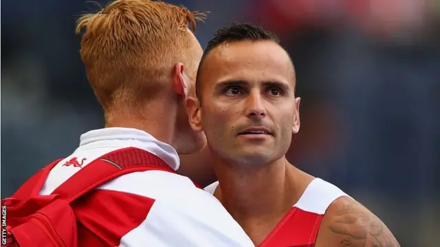 Andy Turner is consoled by Greg Rutherford