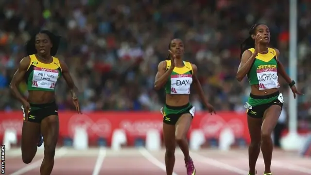 Silver medallist Novlene Williams-Mills of Jamaica (L), gold medallist Stephanie McPherson of Jamaica (R) and bronze medallist Christine Day