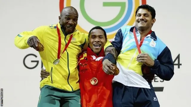 Silver medallist Simplice Ribouem of Australia, gold Medallist Steven Kukuna Kari of Papua New Guinea and bronze medallist Chandrakant Dadu Mali of India