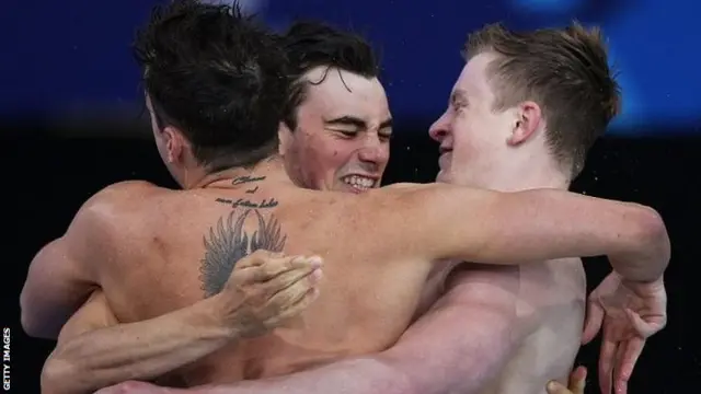 Chris Walker-Hebborn, Adam Barrett and Adam Peaty of England celebrate