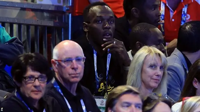 Jamaica's Usain Bolt watches the netball match between Jamaica and New Zealand