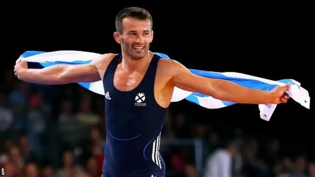 Viorel Etko of Scotland celebrates winning the bronze medal