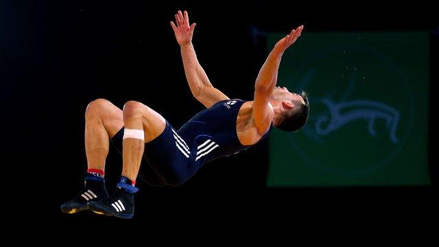 Scotland's Viorel Etko does a back flip at the 2014 Commonwealth Games in Glasgow