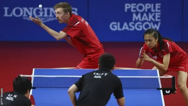 Liam Pitchford and Tin-Tin Ho in red kit