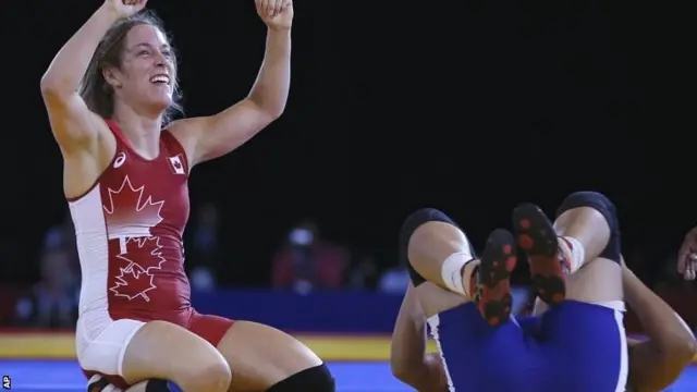 Danielle Lappage, left, of Canada celebrates winning the gold medal