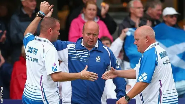 Paul Forster, David Peacock and Alex Marshall of Scotland celebrate