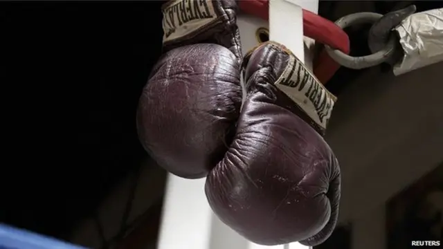 The 1971 Muhammad Ali gloves from his first Joe Frazier bout are pictured in this undated handout photo courtesy of Heritage Auctions received July 31, 2014