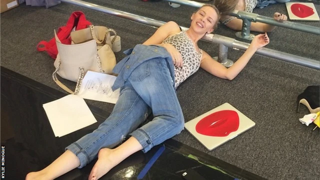 Kylie Minogue resting during rehearsals for the Commonwealth Games closing ceremony