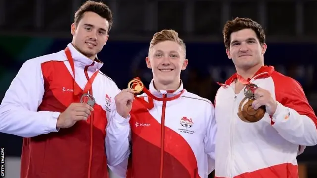 England's Kristian Thomas, gold medallist Englan's Nile Wilson and bronze medallist Canada's Kevin Lytwyn