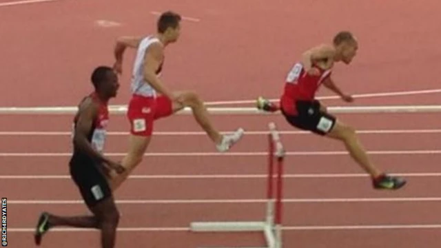 Richard Yates competes in hurdles