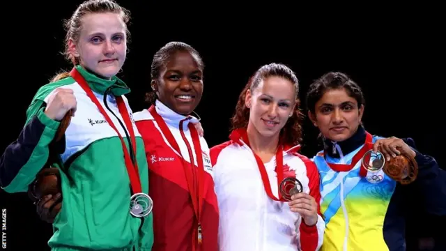 Gold medalist Nicola Adams (2ndL) of England poses with silver medalist Michaela Walsh (L) of Northern Ireland and bronze medalists Mandy Bujold of Canada and Pinki Rani of India