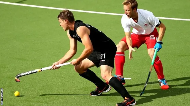 Steve Edward of New Zealand is pressured by Barry Middleton of England